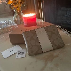 Coach Signature Wristlet.